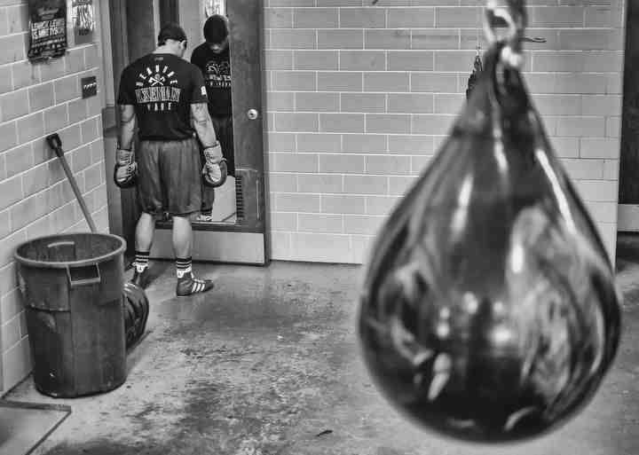 Toledo firefighter DeAndre Ware, who is also an undefeated professional boxer with a record of 12-0, reflects during a workout at Glass City Boxing in Toledo.  (Jeremy Wadsworth / The Blade)